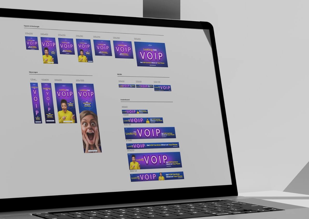 Laptop screen showing a design layout with various banner ads for a VOIP company, including different sizes and styles.