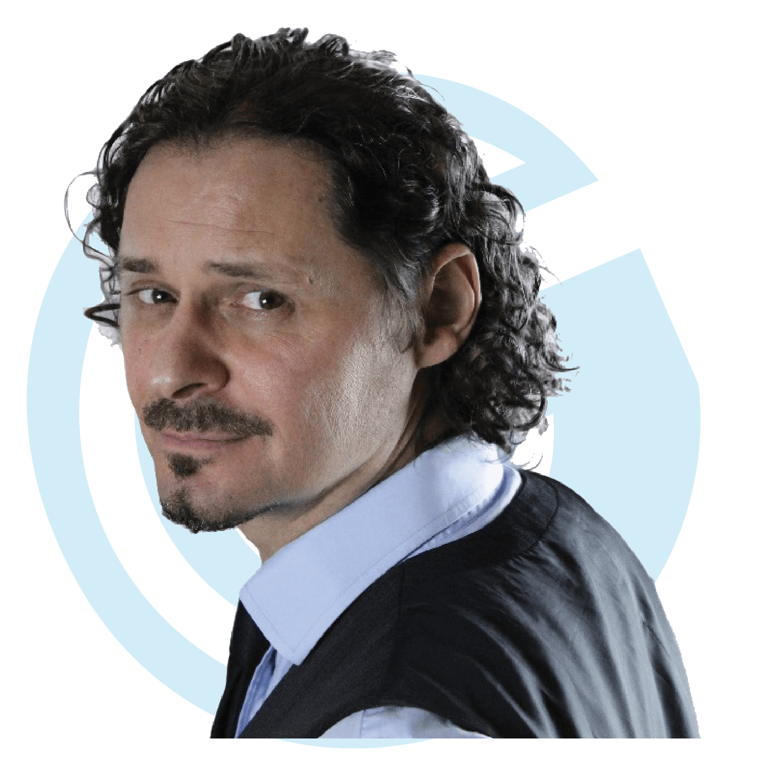 Professional-looking man with curly dark hair and a light blue shirt paired with a black vest. The background features a stylized blue circular design.
